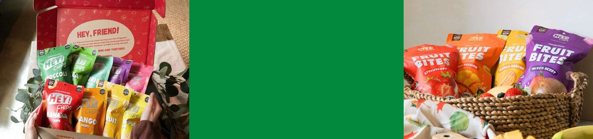 Assorted Hey! Chips packages including 'Fruit Bites' in a box and on a table with green background in the middle.