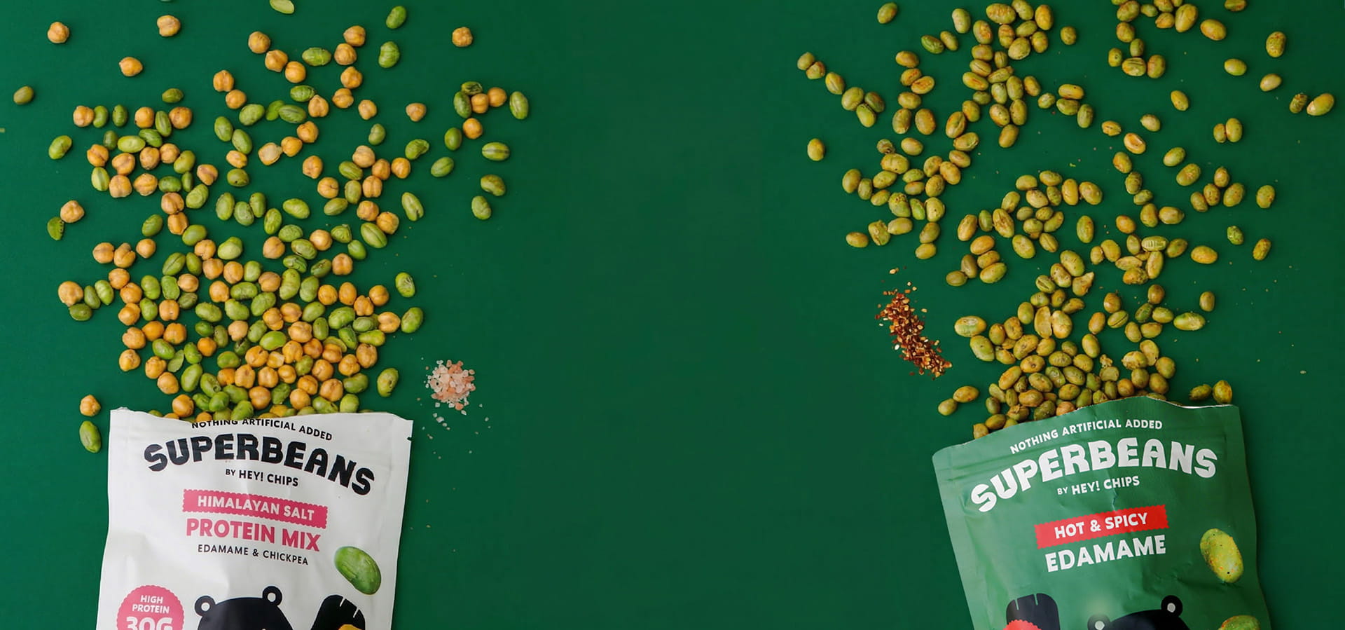 Superbeans by Hey! Chips protein mix packages with green and red labels on a green background